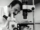 grayscale photography of doctor using microscope